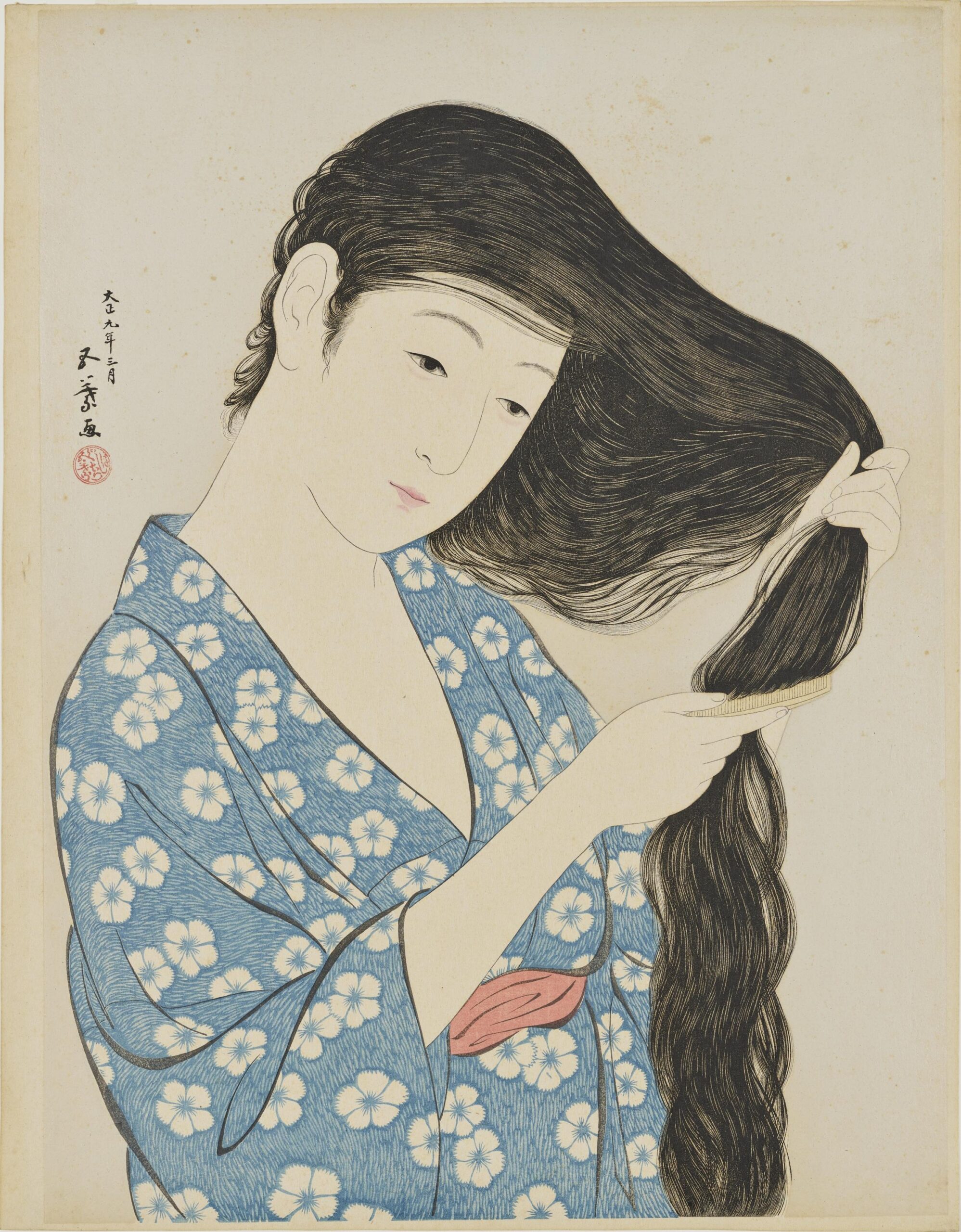 髪梳ける女